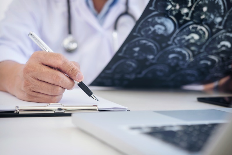 stroke doctor examining xrays