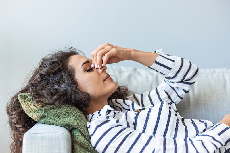 Subarachnoid hemorrhage woman suffering from headaches