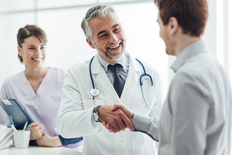 doctor and patient shaking hands
